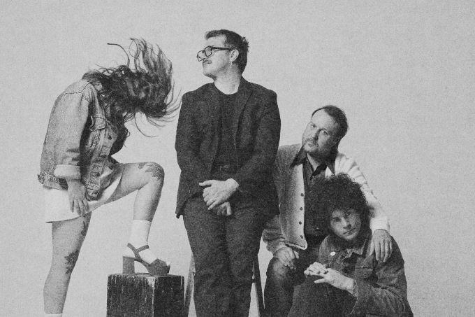 Gruppenbild mit drei Männer und einer Frau